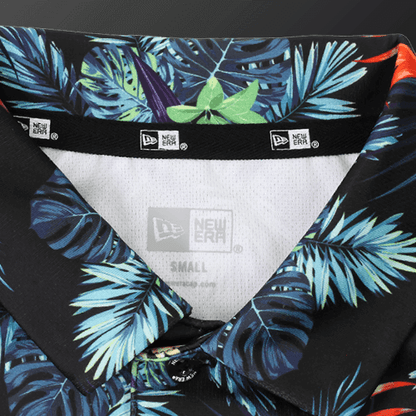 Close-up of the collar of a Zodia Botanical Polo Shirt featuring vibrant tropical patterns.