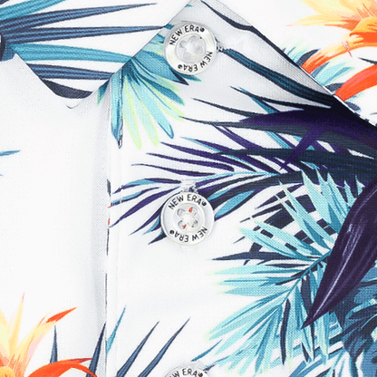 Close-up of Zodia Botanical Polo Shirt detailing with vibrant botanical pattern and branded buttons.