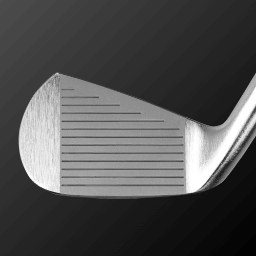 Close-up of Zodia Caiman IV MB golf club head, showcasing precision grooves and polished finish.