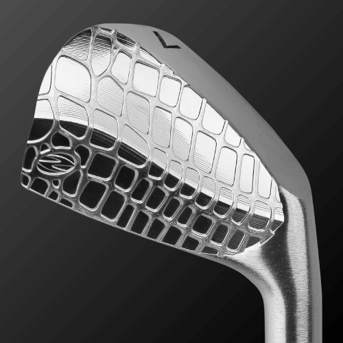 Close-up of Zodia Caiman IV MB golf club head, showcasing its polished design and distinctive pattern.