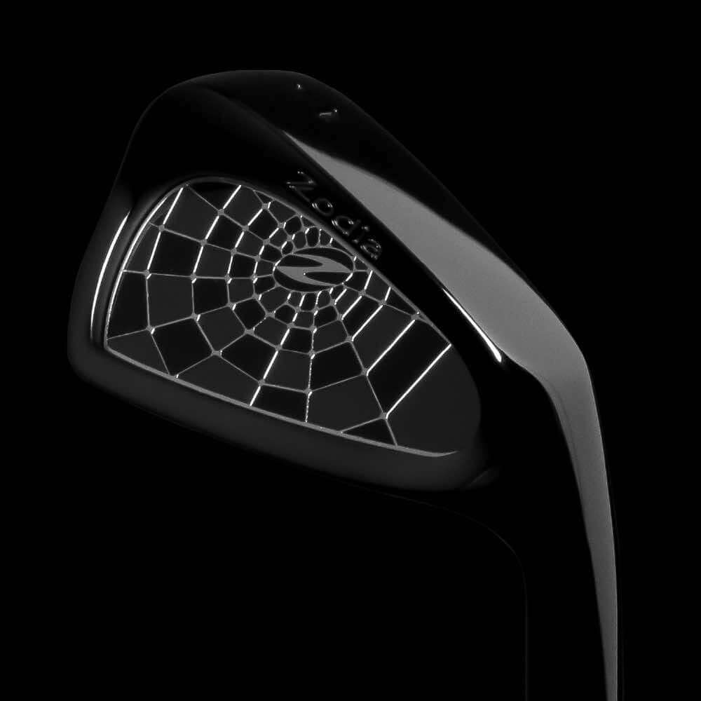 Zodia CAVITY BADGE DLC Black golf club head showcasing unique spider web design on the face.