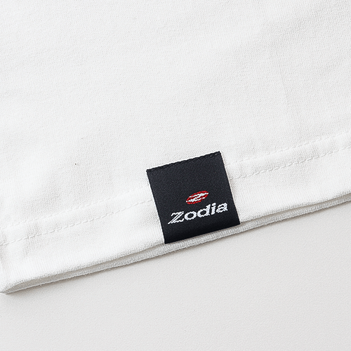 Zodia brand label on a white t-shirt highlighting quality craftsmanship in casual apparel.