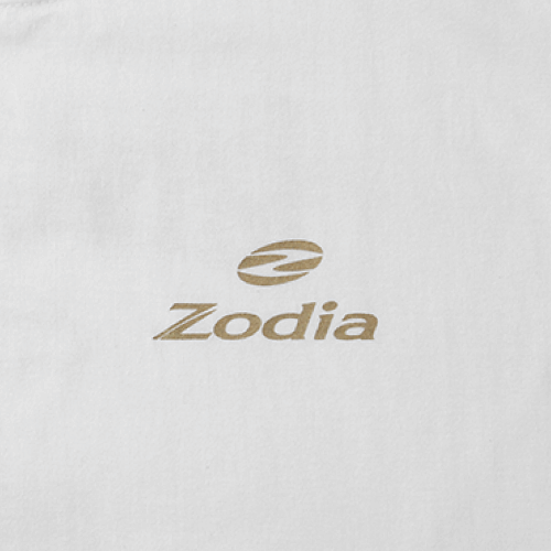 Zodia logo printed in gold on a white fabric background, representing premium quality and branding.