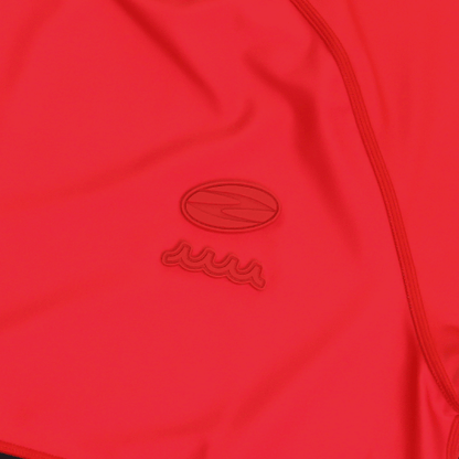 Close-up of a red mock neck shirt featuring muta's logo, showcasing unique design and high-quality fabric.
