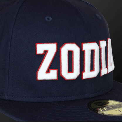 Navy Zodia × NEW ERA 59FIFTY Flat Visor Cap featuring bold white lettering on a classic design.