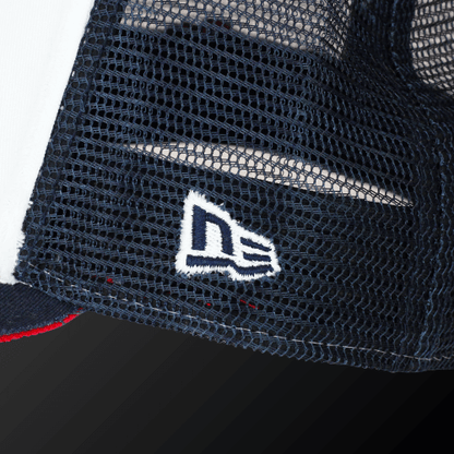 Close-up of the Zodia x NEW ERA 9FORTY cap featuring the embroidered New Era logo on a navy mesh panel.