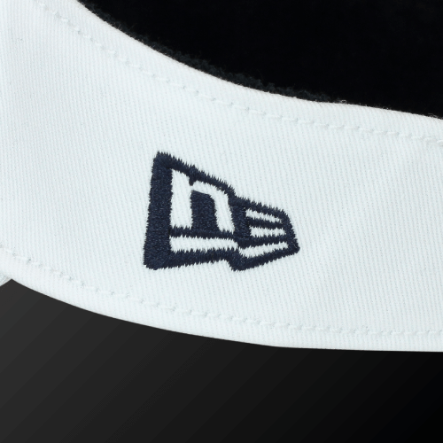 Close-up of Zodia x NEW ERA sun visor featuring the iconic New Era logo on a classic white band.