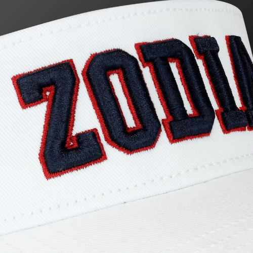 Close-up of the Zodia x NEW ERA sun visor showcasing bold embroidered logo in red and navy on a white background.