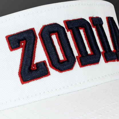Close-up of the Zodia x NEW ERA sun visor showcasing bold embroidered logo in red and navy on a white background.