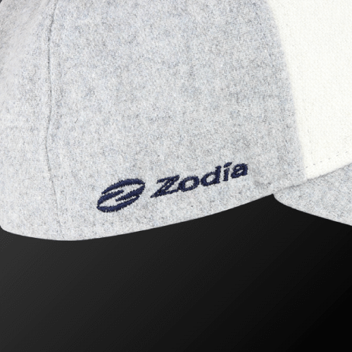 Close-up of Zodia × NEW ERA wool cap showcasing gray fabric and navy logo, perfect for autumn and winter outfits.
