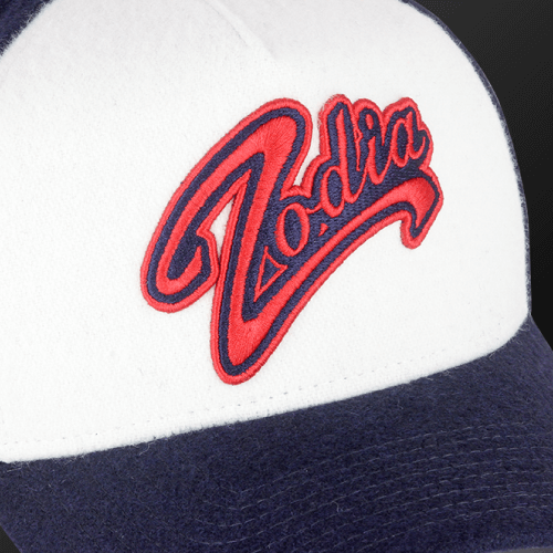 Zodia x NEW ERA Wool Cap featuring red logo on a white and navy design, perfect for autumn and winter outfits.