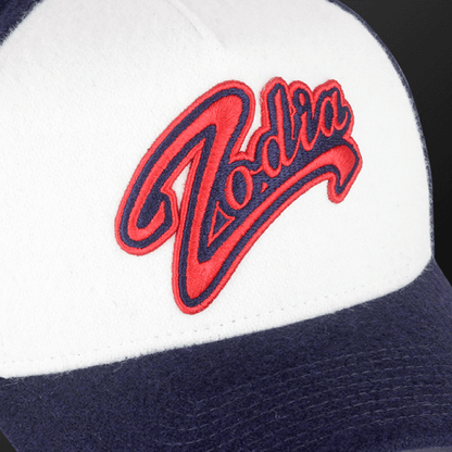 Zodia x NEW ERA Wool Cap featuring red logo on a white and navy design, perfect for autumn and winter outfits.