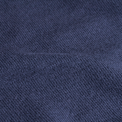 Close-up of Zodia Zip-Up Sweater fabric showcasing the rich navy knit texture and high-quality craftsmanship.